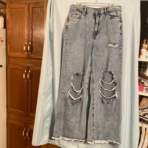 Light denim bell bottoms with big rips